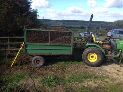John Deere on horse manure duties